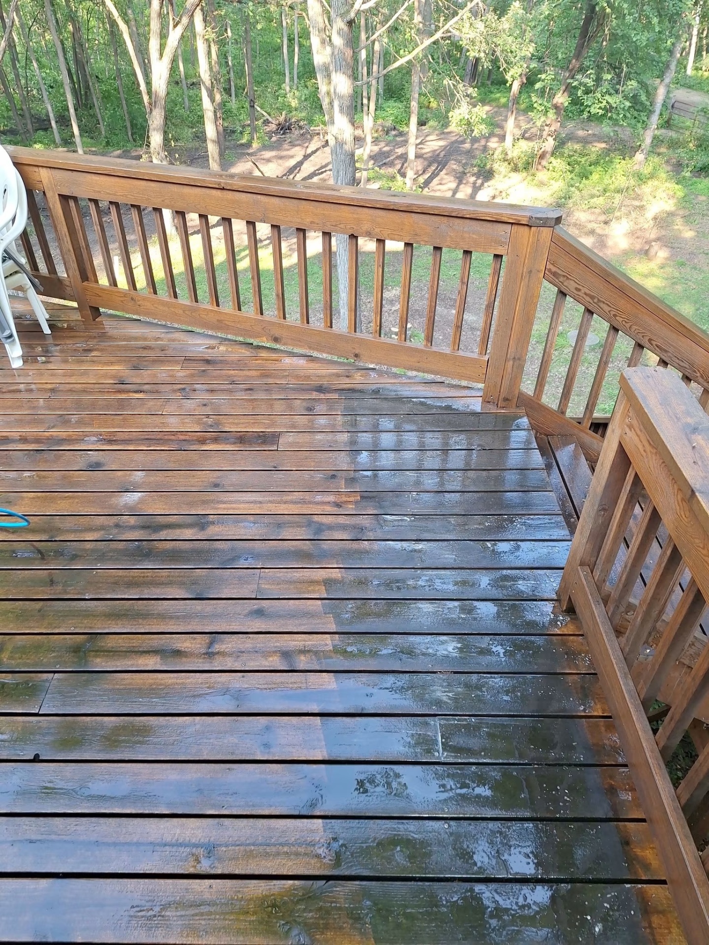 Wood deck freshly cleaned, boards rich and dark