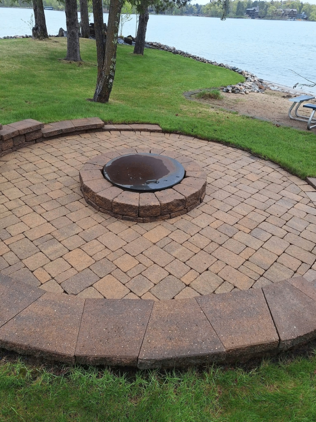 Paver fire pit patio cleaned by the lake
