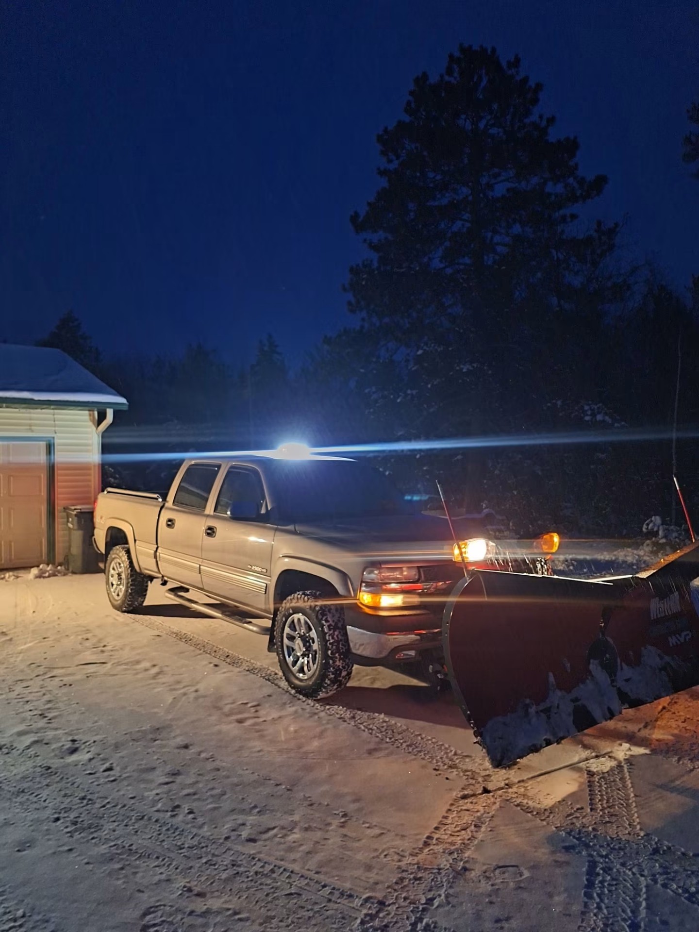 Plow truck working through a Minnesota snowstorm